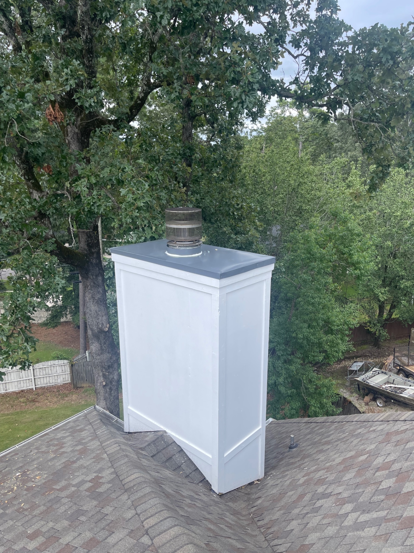 Freshly rebuilt and painted chimney chase with new metal cap