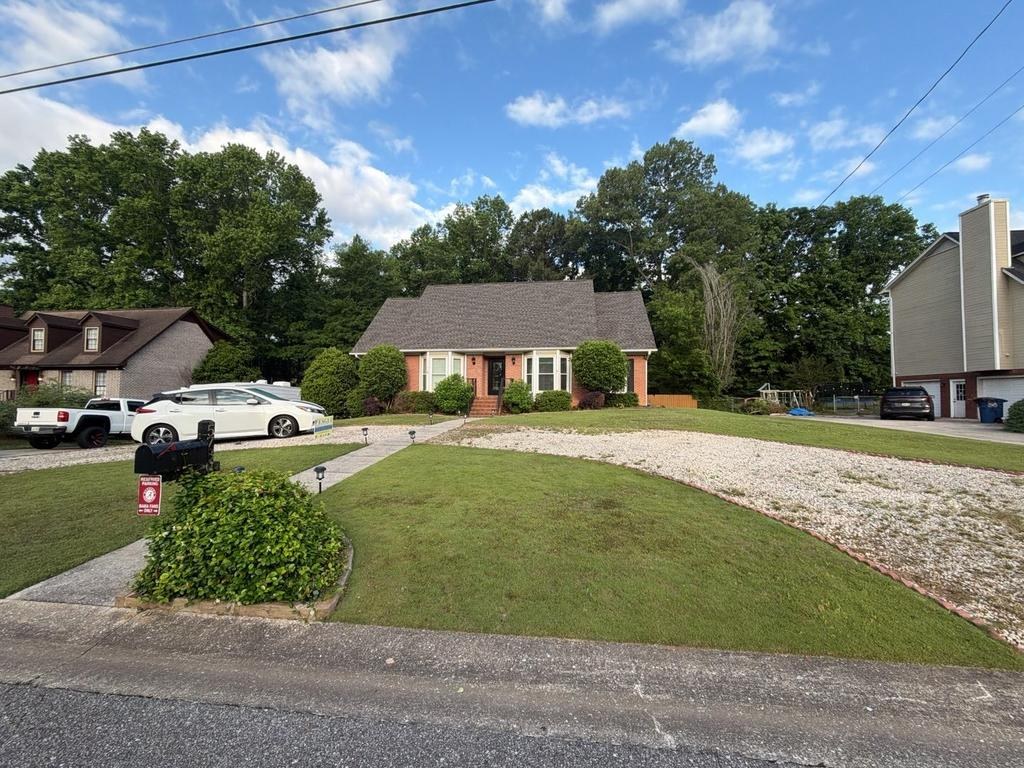 Front exterior of the same home after roof replacement with refreshed curb appeal