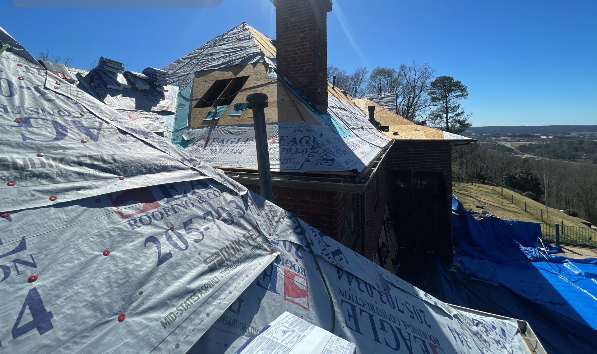 Brick estate mid tear-off during roof replacement
