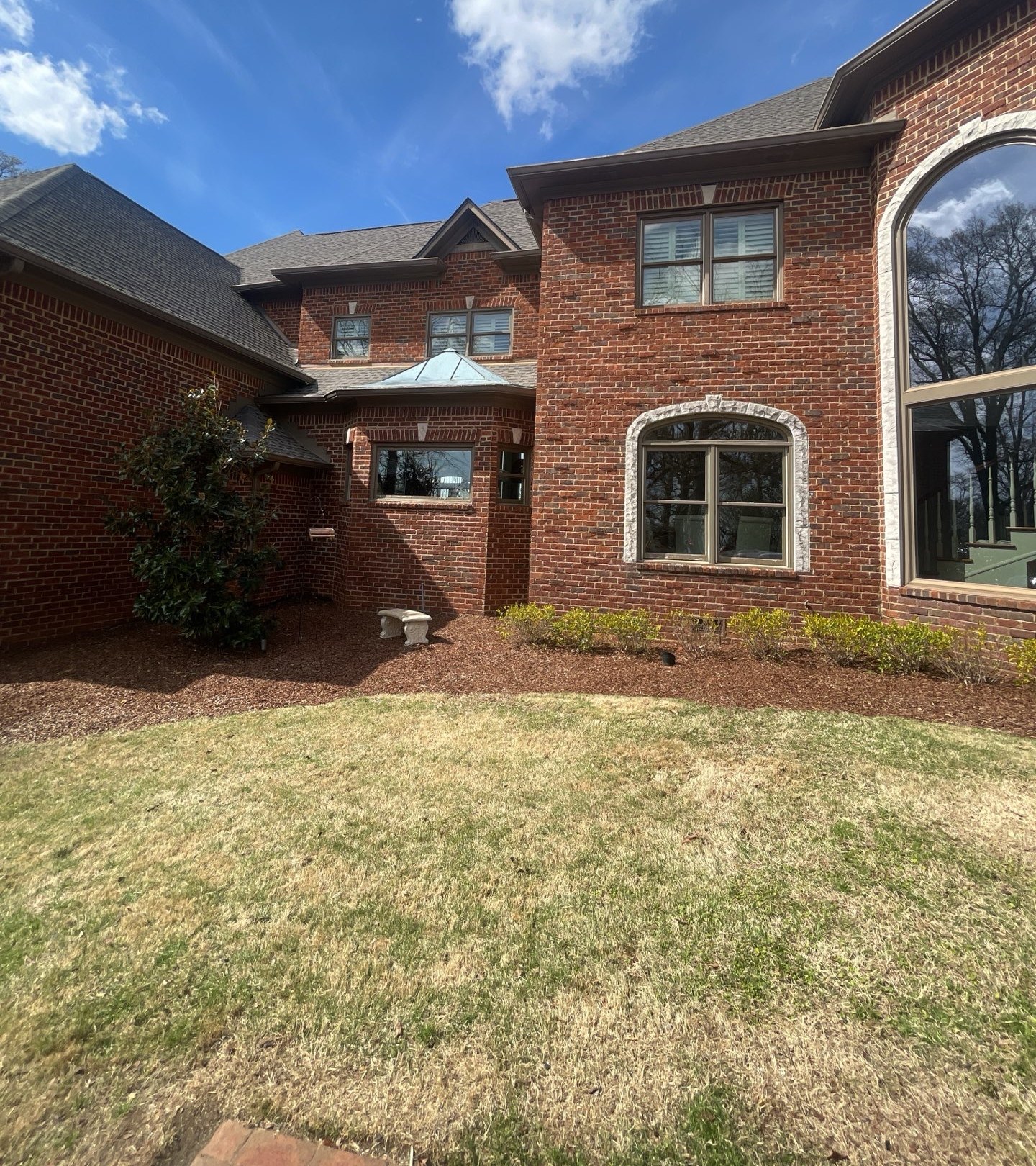 Brick estate with a finished new architectural shingle roof