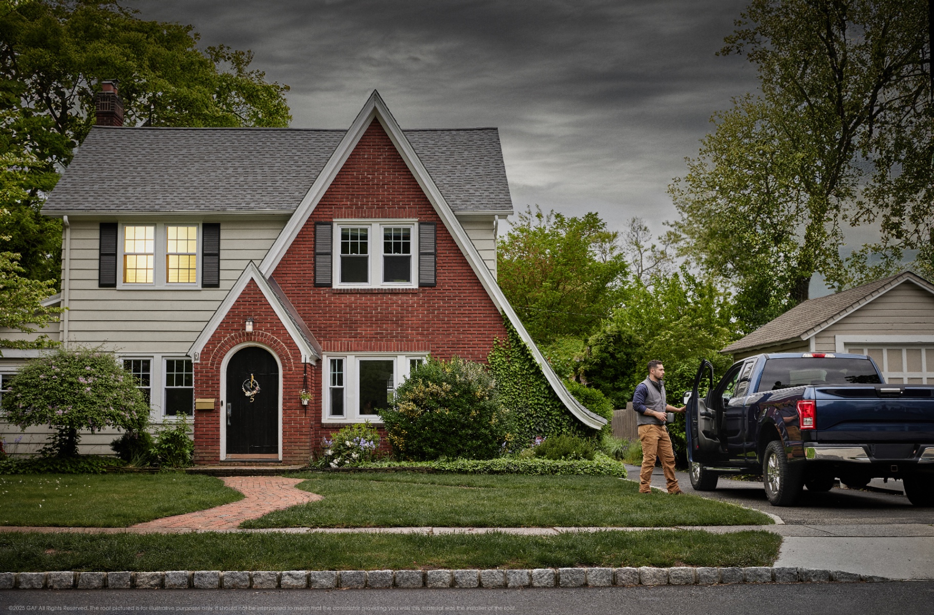 Roofing professional arriving at a brick home with a new GAF roof