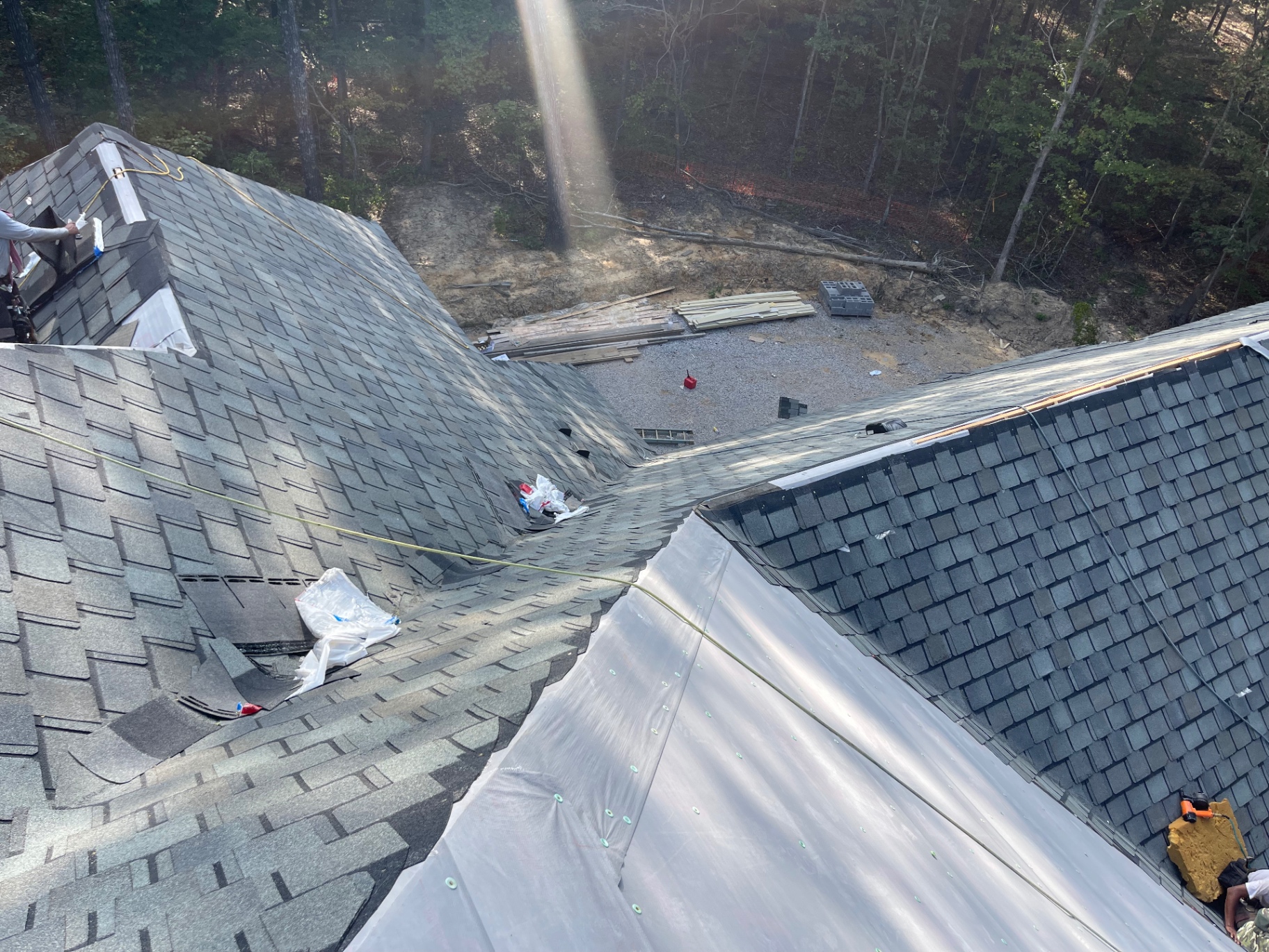 Roof valley and intersecting slopes during shingle installation and waterproofing work