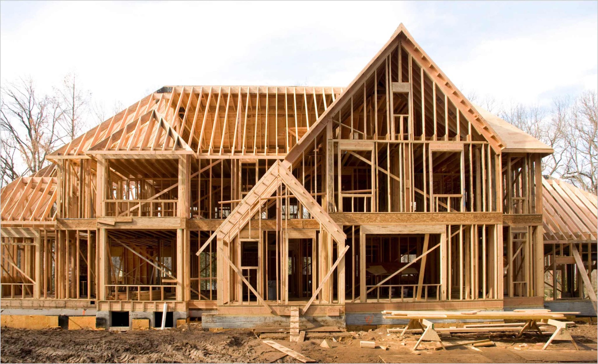 Large custom home stud framing and roof structure under construction