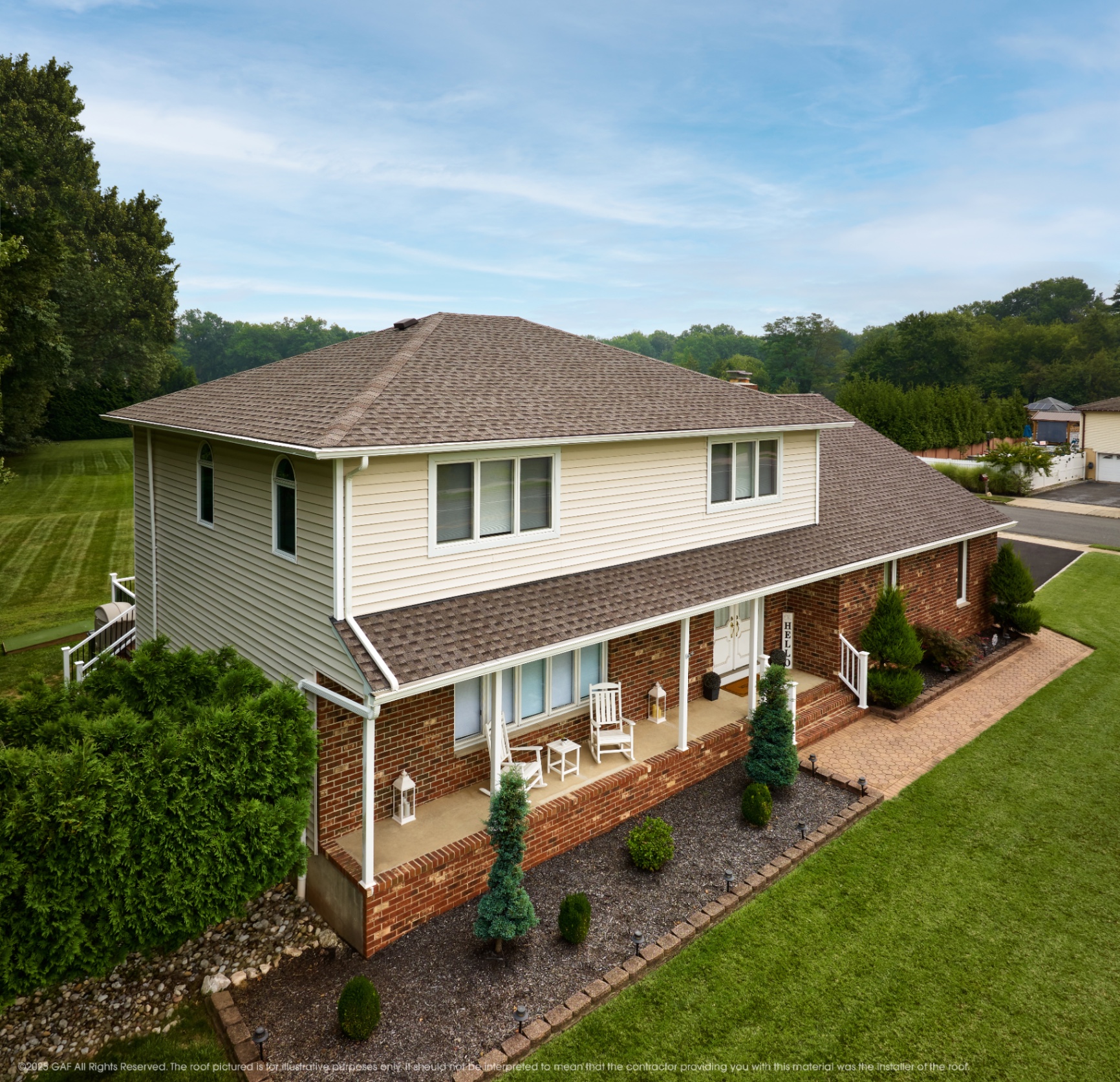 Two-story home with a Mission Brown GAF shingle roof